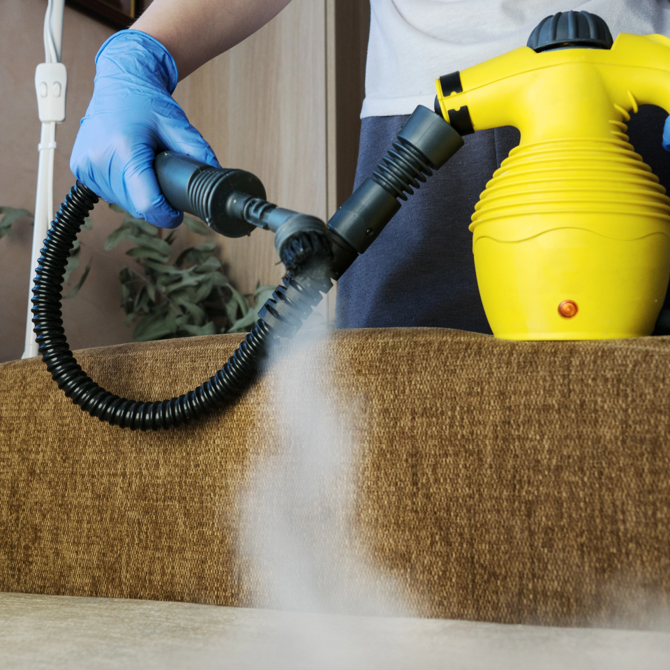 upholstery cleaning machine and worker